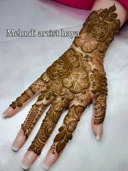A full view of the 3D floral design, showcasing how the pattern flows from the wrist down to the fingertips. This is a great example of an advanced, statement bridal design.