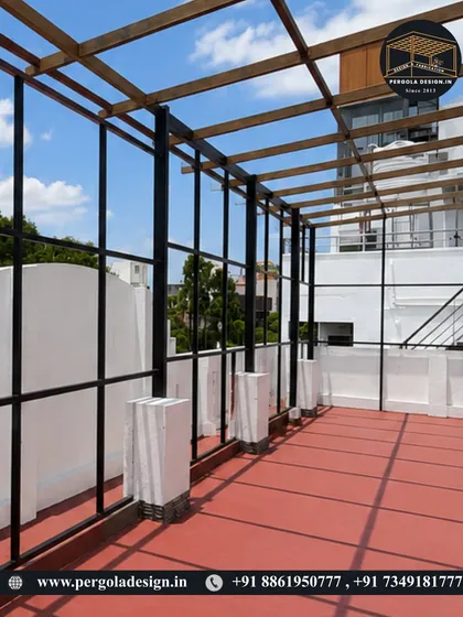 A wide shot of the rooftop space, showing how the pergola frame defines the area.