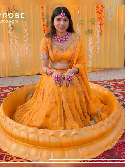 Radiant in yellow for the Haldi ceremony. This client looks stunning in a traditional setting, wearing one of my vibrant lehengas perfect for the occasion.
