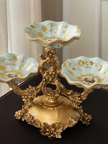 I believe hosting should always be done in style. This Victorian-inspired three-tiered server is perfect for displaying everything from appetizers to desserts. The ornate gold-finished metalwork and delicate floral details on the bowls bring a touch of regal elegance to your dining table.