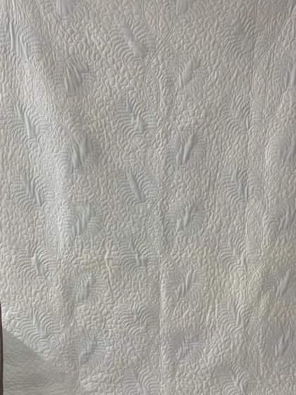 The back of the leaf-themed quilt.