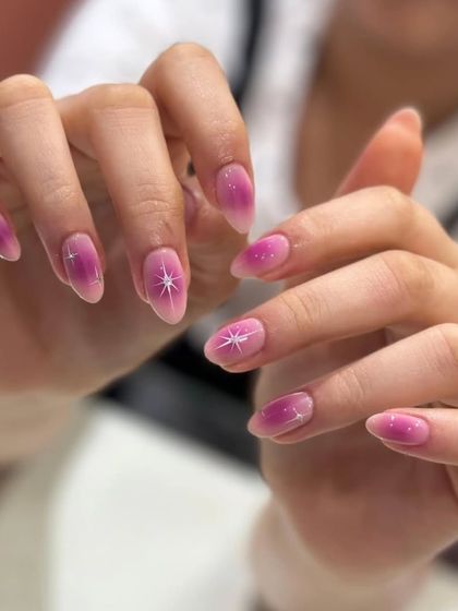Another angle of the starry gradient pink nail art, showing off its dreamy quality.