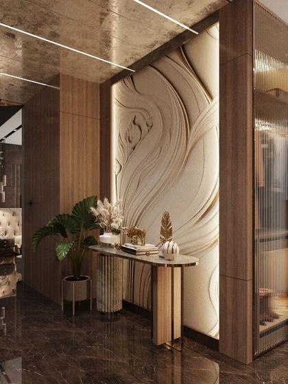 In our designs, the wall itself becomes a piece of art. This corridor features a custom 3D wall panel with a flowing, organic design, creating a stunning focal point and adding a layer of artistic sophistication to the home's interior.