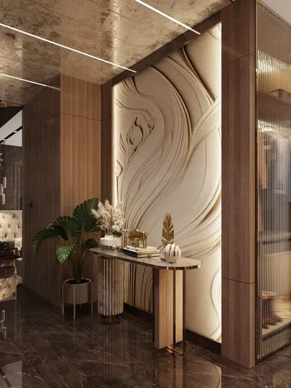 In our designs, the wall itself becomes a piece of art. This corridor features a custom 3D wall panel with a flowing, organic design, creating a stunning focal point and adding a layer of artistic sophistication to the home's interior.