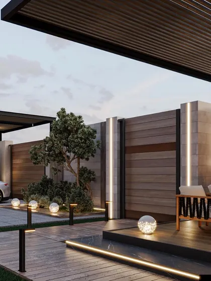 This view of the backyard oasis shows how we integrate different functional zones, including a covered seating area, a driveway, and landscape lighting, into one cohesive design.