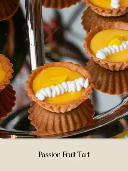 My classic Passion Fruit Tart. The bright, tangy passion fruit curd fills a buttery tart shell, finished with a simple yet elegant piping of white cream.