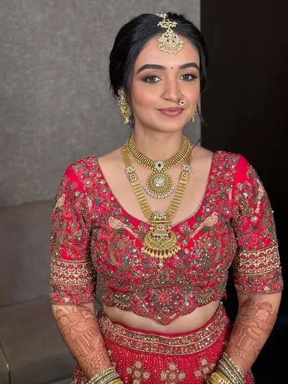 A full-frontal portrait showcasing the complete soft glam look. The makeup is balanced, ensuring her features are enhanced without being overpowered.