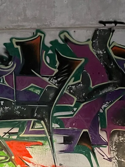 Another shot of "The pyre" piece. The colors look like they're burning against the dark, grimy wall. It's about finding beauty in decay.
