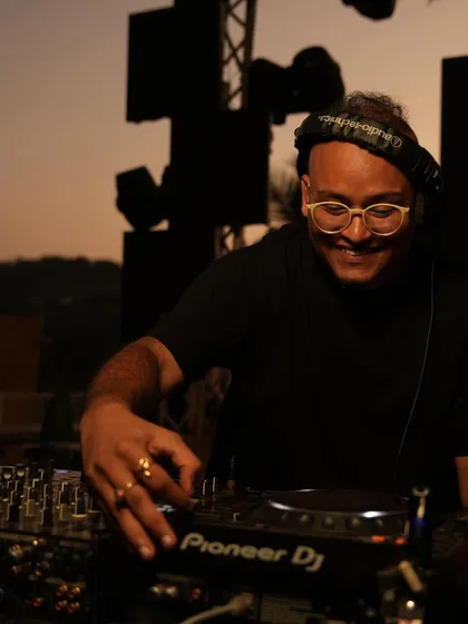 A duplicate of the smiling DJ shot.