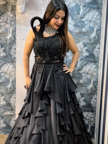 For a chic and modern look, this black tiered ruffle gown is a showstopper. It's an ideal rental for cocktail parties, receptions, or any formal event where you want to combine elegance with a touch of drama.