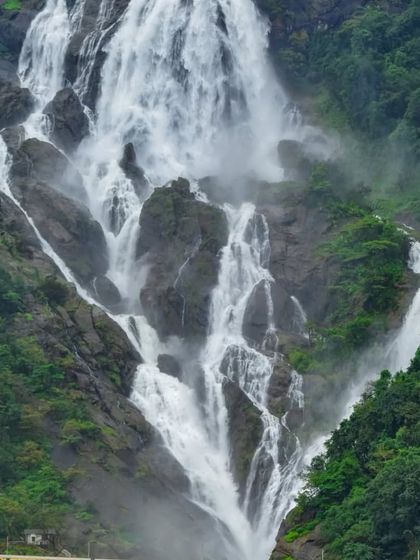 The majestic Dudhsagar Falls, cascading down the mountainside in a powerful torrent. We organize weekend treks from Bangalore to witness this monsoon wonder.