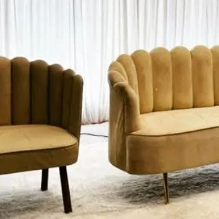 A look at the stylish, modern furniture we source for our events. This scalloped velvet sofa and armchair in a mustard hue add a touch of contemporary elegance.