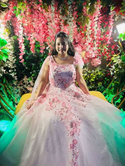 A closer look at the happy client in the fairytale rental gown. The floral details and the sheer volume of the skirt make it a truly special outfit.