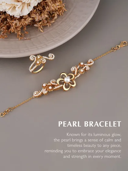 There is a timeless beauty in pearls. This pearl bracelet and matching ring set features a central pearl in a golden floral design, accented with diamonds. I designed this to bring a sense of calm and elegance, reminding you to embrace your strength in every moment.