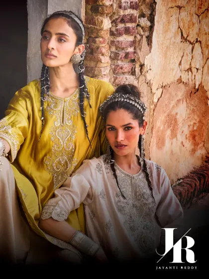 Two models showcase the regal silhouettes and standout craftsmanship of Jayanti Reddy's collection. These tunics are perfect for those who appreciate understated luxury.