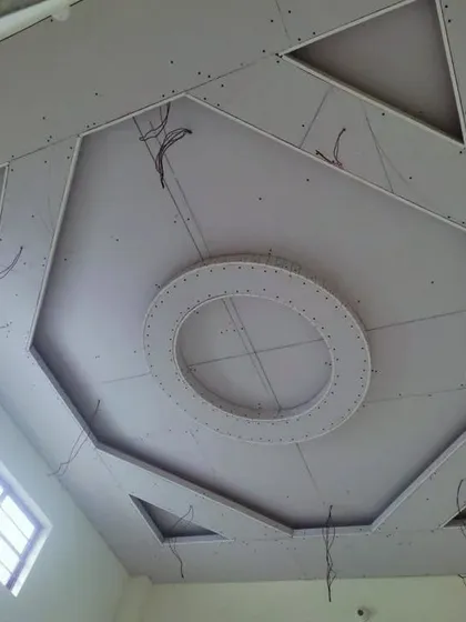 A unique geometric design combining an octagon, a circle, and triangles. This image shows the raw structure with wiring ready for installation.