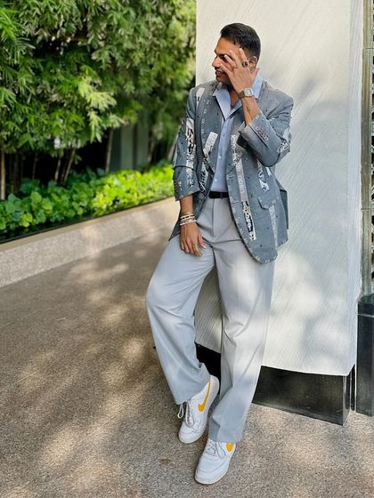 Shravan Shah makes a statement in our Paradox Suit jacket. The unique mix of wool, silk, and linen, plus detailed embroidery, makes this piece the pinnacle of contemporary fashion.