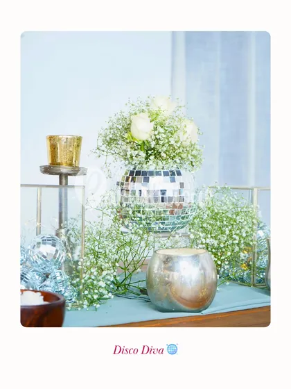 Disco Diva. Not every bride wants the same thing. This tablescape with a disco ball vase and baby's breath is for the bride who wants to sparkle.