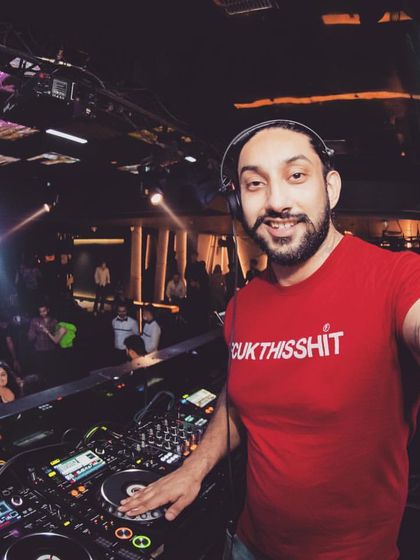 A selfie from the DJ booth with a packed club in the background. I love capturing the energy of a great night.