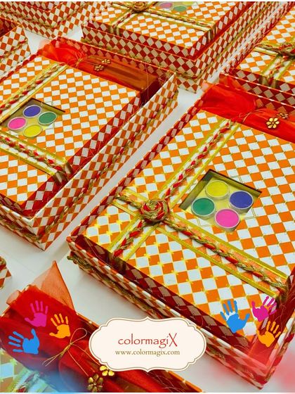 Our checkered orange and white Holi hampers are perfect for bulk gifting. Each box includes a small palette of colors, making it a fun and festive giveaway for parties or corporate events.
