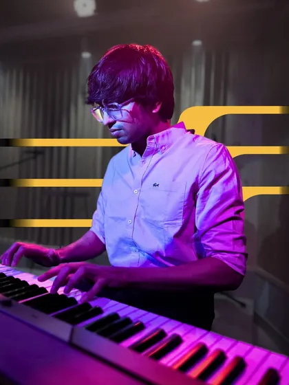 A keyboardist laying down a smooth melody. Our recitals feature a wide range of musical styles, from rock to jazz and pop.