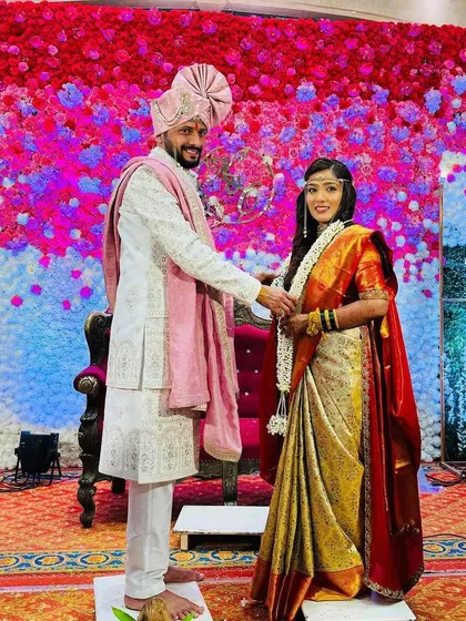 A couple during their wedding ceremony, exchanging our simple yet elegant tuberose varmalas.