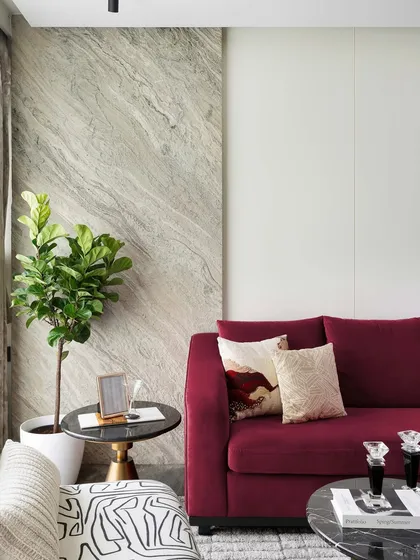 A closer look at how we use greenery to soften a modern space. The fiddle leaf fig plant adds a natural, organic element that complements the clean lines and luxurious materials of the room.