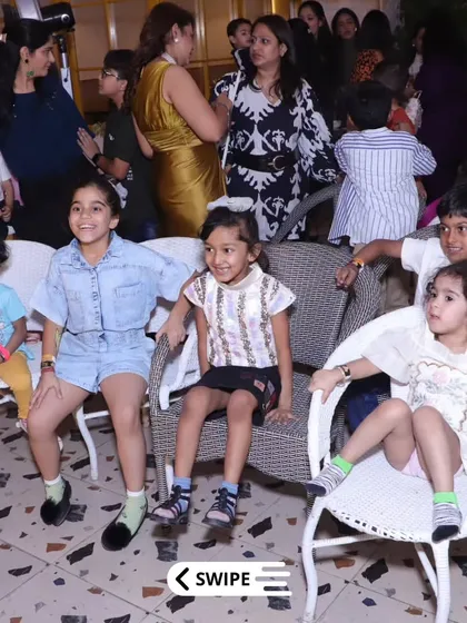 Young party guests seated and watching the entertainment, fully engaged in the fun of the celebration.