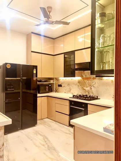 A kitchen should be as beautiful as it is functional. For this open-plan kitchen renovation, I used sleek, high-gloss cabinetry, integrated appliances, and dramatic under-cabinet lighting to highlight the beautiful marble backsplash, creating a space that’s perfect for both cooking and socializing.