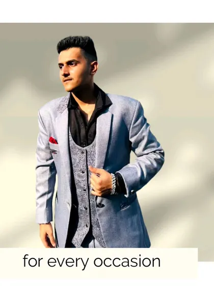 Another look at our client in the stylish grey three-piece suit. It's a versatile outfit that's perfect for a variety of occasions.