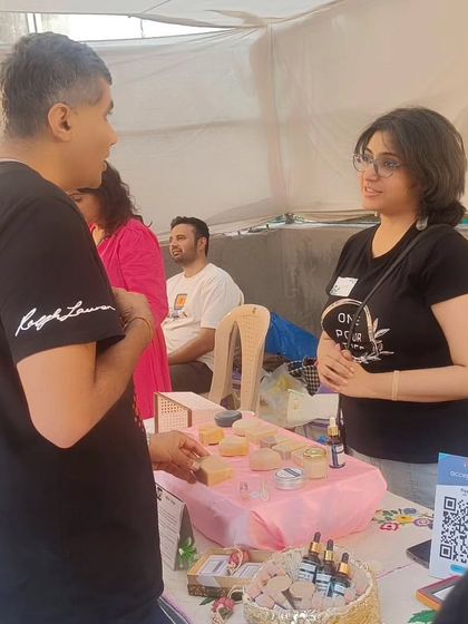 A candid shot of me talking to a customer at the fair.