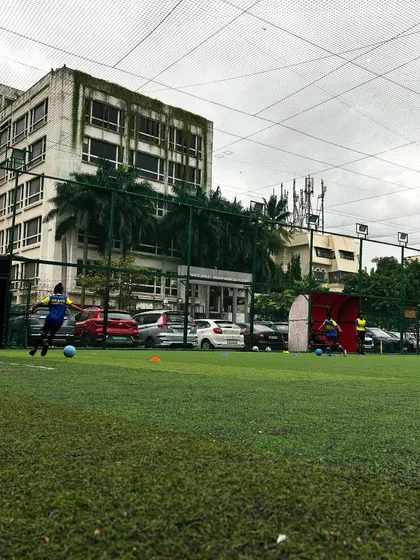 A wide view of our training ground, with players spread out, engaged in various drills.