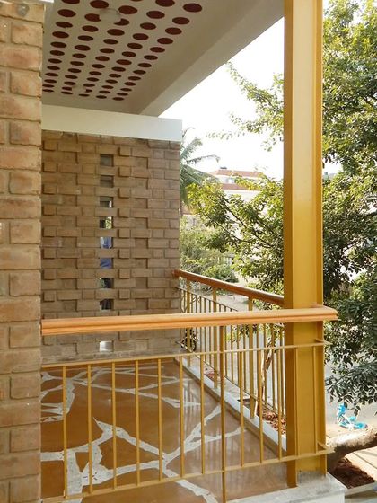 The pattern of the brick jali and the flooring creates a rich textural experience on this balcony.