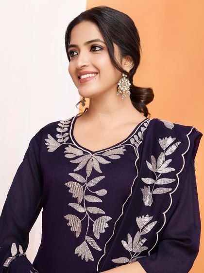 A wine-colored vichitra silk kurta with beautiful silver thread embroidery. The leaf motifs give it a unique, nature-inspired touch.