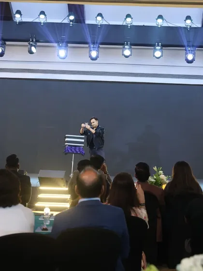 A view from the audience during one of my mentalism routines. I design my acts to be engaging and mystifying, ensuring everyone in the room is captivated by the performance.