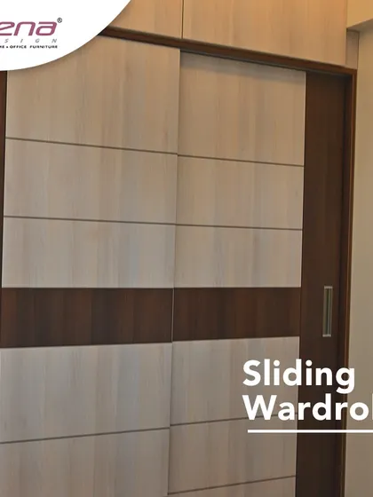 A classic two-tone sliding wardrobe. The combination of light and dark wood laminates creates a timeless look that is both elegant and easy to maintain, making it a popular choice for master bedrooms.
