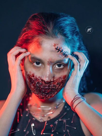 A dramatic shot with coloured lighting to enhance the horror effect of the SFX makeup.