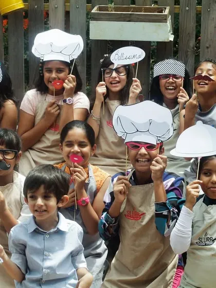 Posing with props after a successful cooking party. It's all about fun, laughter, and making memories that will last long after the food is gone.