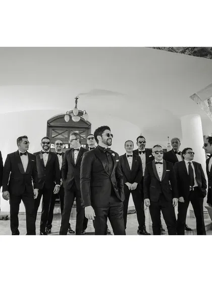 The "BWOYs" arrive. Farhan and his groomsmen make a stylish entrance in their tuxedos. This black and white shot has a classic, cool, and cinematic feel.