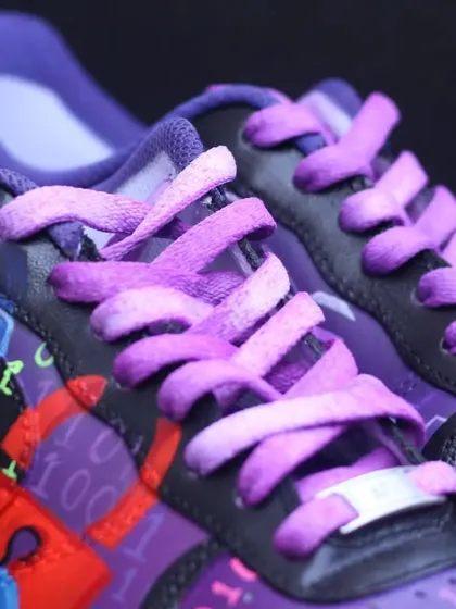 A close-up of the hacker-themed custom, showing the anonymous mask and dyed laces.