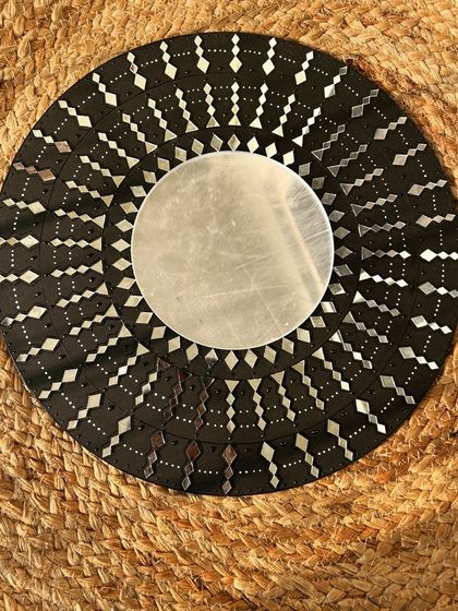 A finished abstract mirror piece with geometric patterns, showing another style of decorative art you can create.