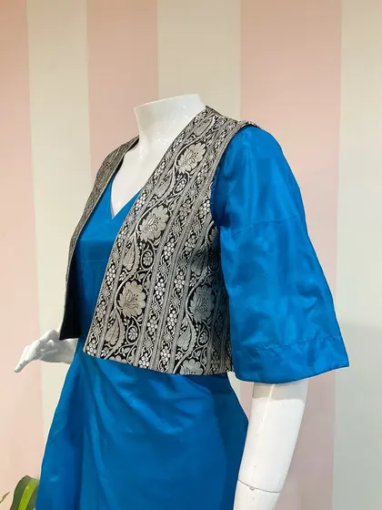 Repurposing a vintage Benaras saree into a versatile and wearable two-piece outfit, featuring a dress and a brocade jacket.