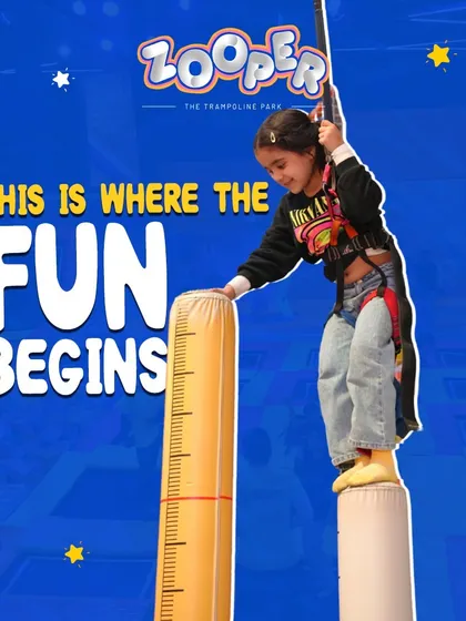This is where the fun begins. A young guest gets ready to take on the climbing pillars, the starting point for a great adventure.