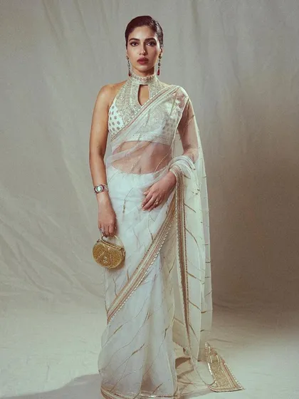 This look for Bhumi Pednekar is pure elegance. I chose this sheer white saree with a high-neck embroidered blouse, perfect for an awards show where she wanted a graceful and sophisticated Indian look.