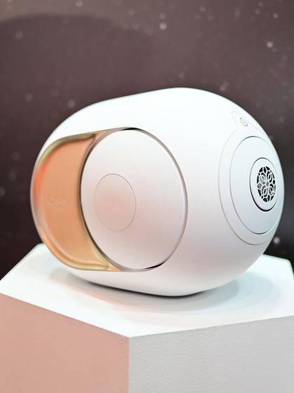 A close-up of the Devialet Phantom speaker, showcasing its unique spherical design and premium finish. This is a new class of speaker, packing groundbreaking technology into a compact and beautiful form.