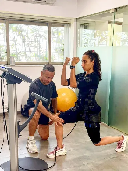 Our founders, the father-daughter duo Samir and Namrata Purohit, demonstrate a partnered EMS balance exercise. This showcases our unique integration of Electric Muscle Stimulation with Pilates principles to maximize muscle activation, improve stability, and accelerate results.