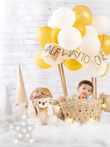 Another view of our little pilot, peeking out from his hot air balloon, ready for adventure.