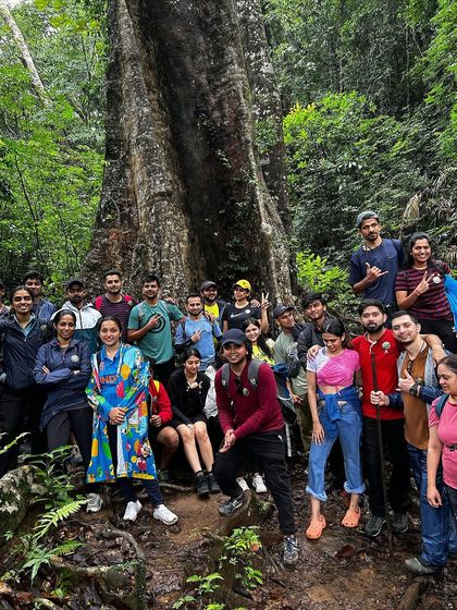 A large group photo in the dense forest of Kodachadri.