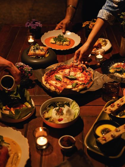 A table full of shared dishes, capturing the joy and connection of a communal meal at Anvaya.