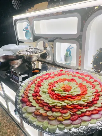 An artfully arranged salad platter, with concentric circles of cucumber, tomato, and onion. I believe even the simplest dishes should be presented beautifully.